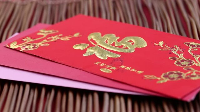 Chinese new year red envelope decoration on wooden table