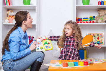 Child with speech therapist on therapy