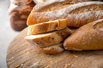 Fresh Homemade Sliced French Baguette Bread On Wooden Bread Board