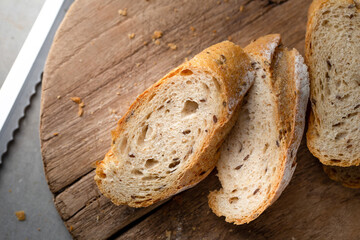 Fresh Homemade Sliced French Baguette Bread On Wooden Bread Board