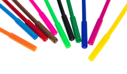 Colored felt-tip pens on a white background.