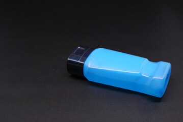 liquid soap or body foam blue transparent  isolated on black background