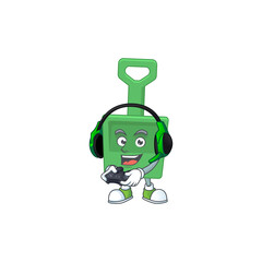 A cartoon design of green sand bucket clever gamer play wearing headphone