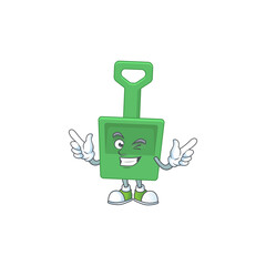 Obraz premium Cartoon drawing concept of green sand bucket showing cute wink eye