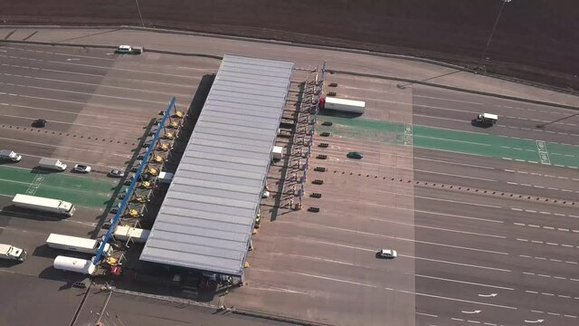 Aerial view of highway with Cars at modern toll road turnpike, entry fee pay gate