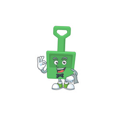 A cartoon image of green sand bucket as a waiter character ready to serve