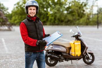 Guy Holding Folder Offering Delivering Services Standing Near Scooter Outdoors