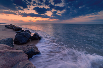 Fototapeta na wymiar Landscape with beautiful sunrise over sea