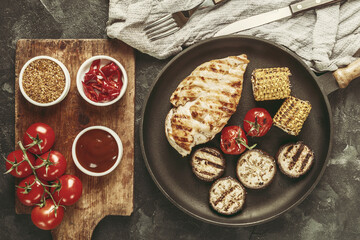 Fried chicken fillet and boiled vegetables