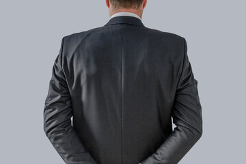 Businessman back over in elegant custom tailored expensive suit posing