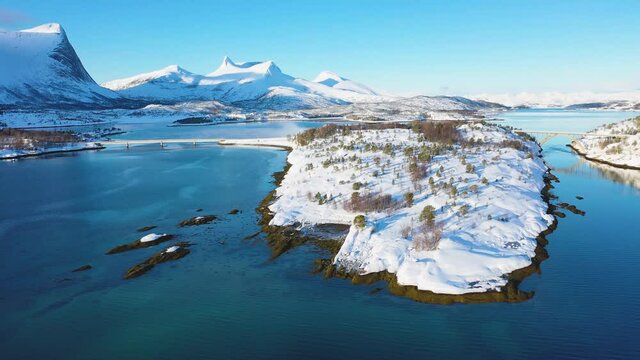 Landscapes of winter Norway. Coast. Ferry. Mountains and fjords in Norway in winter. Panoramic view. Aerial photography. Sunny winter day. Winter card. landscape.