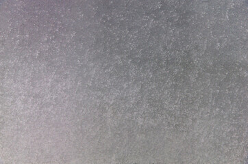 Fototapeta premium Gray grained gradient background with spots.