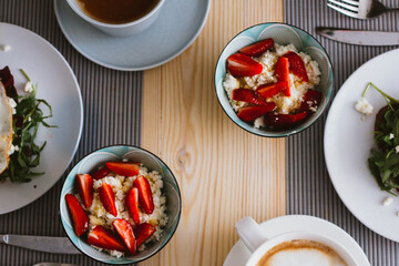 varied breakfast on a wooden table.