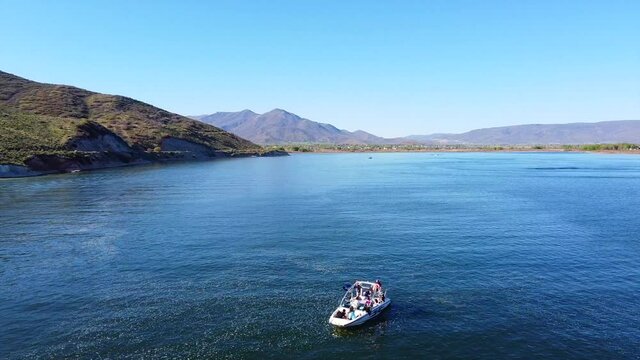 Boating at the lake in early summer with smooth water