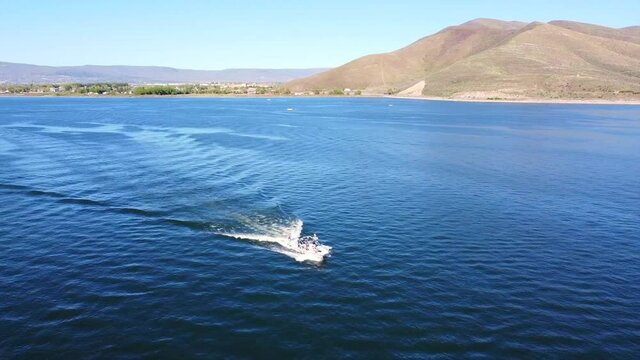 Wake surfing on a smooth lake in early summer