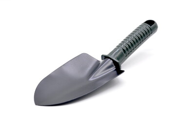 Garden tool, hand shovel with green handle isolated on white background