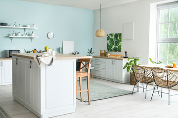 Interior of modern kitchen with stylish table