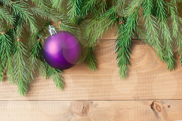 Christmas Tree Pine Branches and Christmas balls on a light background. happy new year