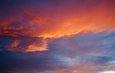 Unbelievable colorful sunset with red scenic clouds.