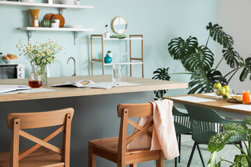Interior of modern kitchen with stylish table