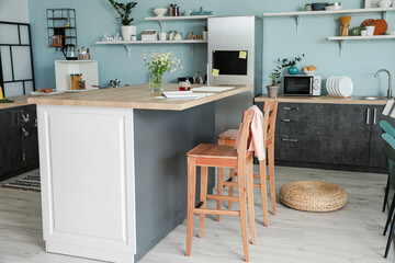 Interior of modern kitchen with stylish table