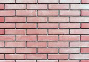 A neatly laid out brick wall. Brickwork.