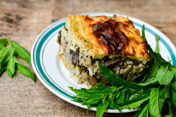  Potato shepherd's pie.  Potato and minced meat  Casserole  with   parmesan cheese and garlic on wooden rustic bakcgound. 