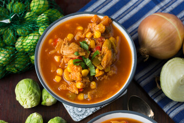 Soup with cabbage, brussel sprouts, sweet corn, pepper and tomatoes. Lecho.