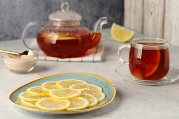 Black tea with lemon, sugar and cinnamon, a tasty and healthy drink for health and vitality.