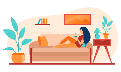 Girl on the couch is drinking coffee or tea.