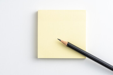 Office desk table pencil and post it on white background.
