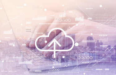 Cloud computing with man using a laptop cityscape background