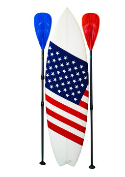 American flag on a white surfboard, USA stars & stripes, paddles & a straw cowboy hat. Shaka hand sign. This is known as the Red, white and blue. Surfing is a lifestyle.