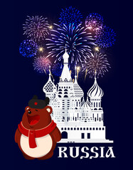 Russia. Moscow. Red Square. Brown bear in scarf and hat stays in front of St. Basil's Cathedral silhouette. Blue background with fireworks.