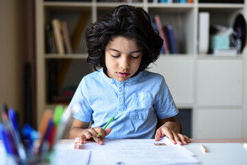 young boy doing his homework