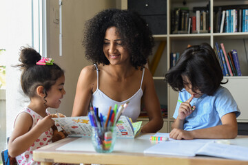 Metis mother tutoring her children at home