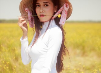 Artistic portrait: a girl in a flower field in Hoang Dau, Vietnam