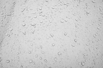 texture of water drops on a dirty window, raindrops on a car glass, weather precipitation autumn...