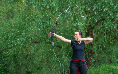 arrow shooting from a bow in nature, sport archery. copy space