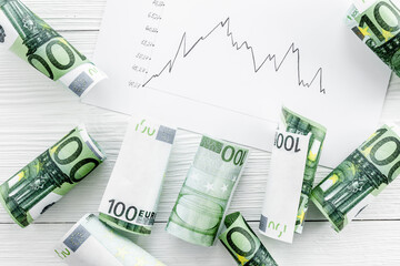 Diagram of stock market prices rates with euro banknote top view