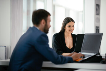 Portrait of businesswoman in factory. Young female architect in suit.	