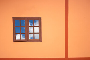 window in the orange wall