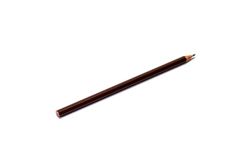 A brown pencil lies diagonally on an isolated white background. Isolate.