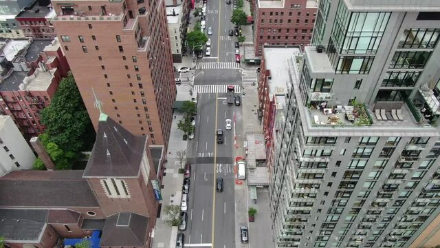overhead aerial cars driving in Midtown Manhattan traffic New York City NYC centered 