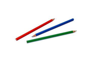 Color pencils 3 pieces of red, blue and green laid out on a white background. Isolate