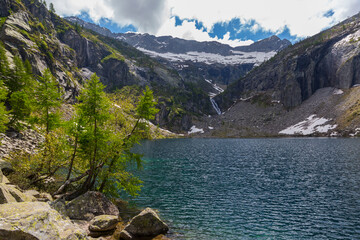 blue lago di Tomeo lake in Swiss alpine mountains in Ticino