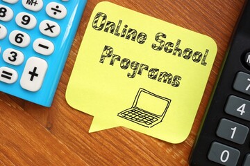 Business concept meaning Online School Programs with sign on the piece of paper.