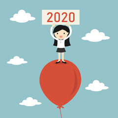 Business concept, Business woman is standing on balloon and holding 