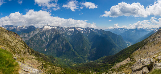 Naklejka na ściany i meble panorama Lavizzara and Maggia valley in Ticino Switzerland, clouds, blue sky