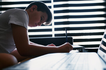 Child studying at home because of the coronavirus